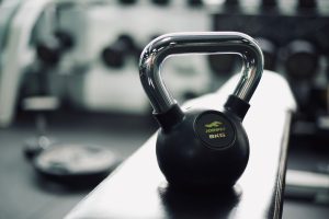 Black kettlebell on gym bench highlighting fitness and strength training equipment. — 4 Key Considerations When Buying Medica