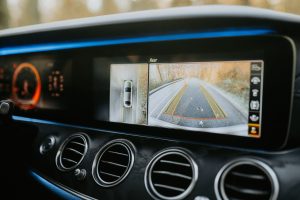Close-up of a car dashboard showcasing a rear-view camera display and modern electronics. — Can any mattress go on an adjusta