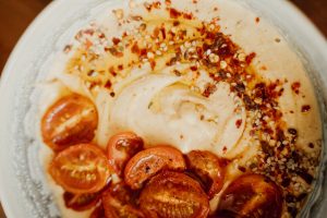 Delicious spiced hummus topped with roasted cherry tomatoes and sesame seeds. — Cat Food - 7 Tips On What To Avoid Feeding Yo
