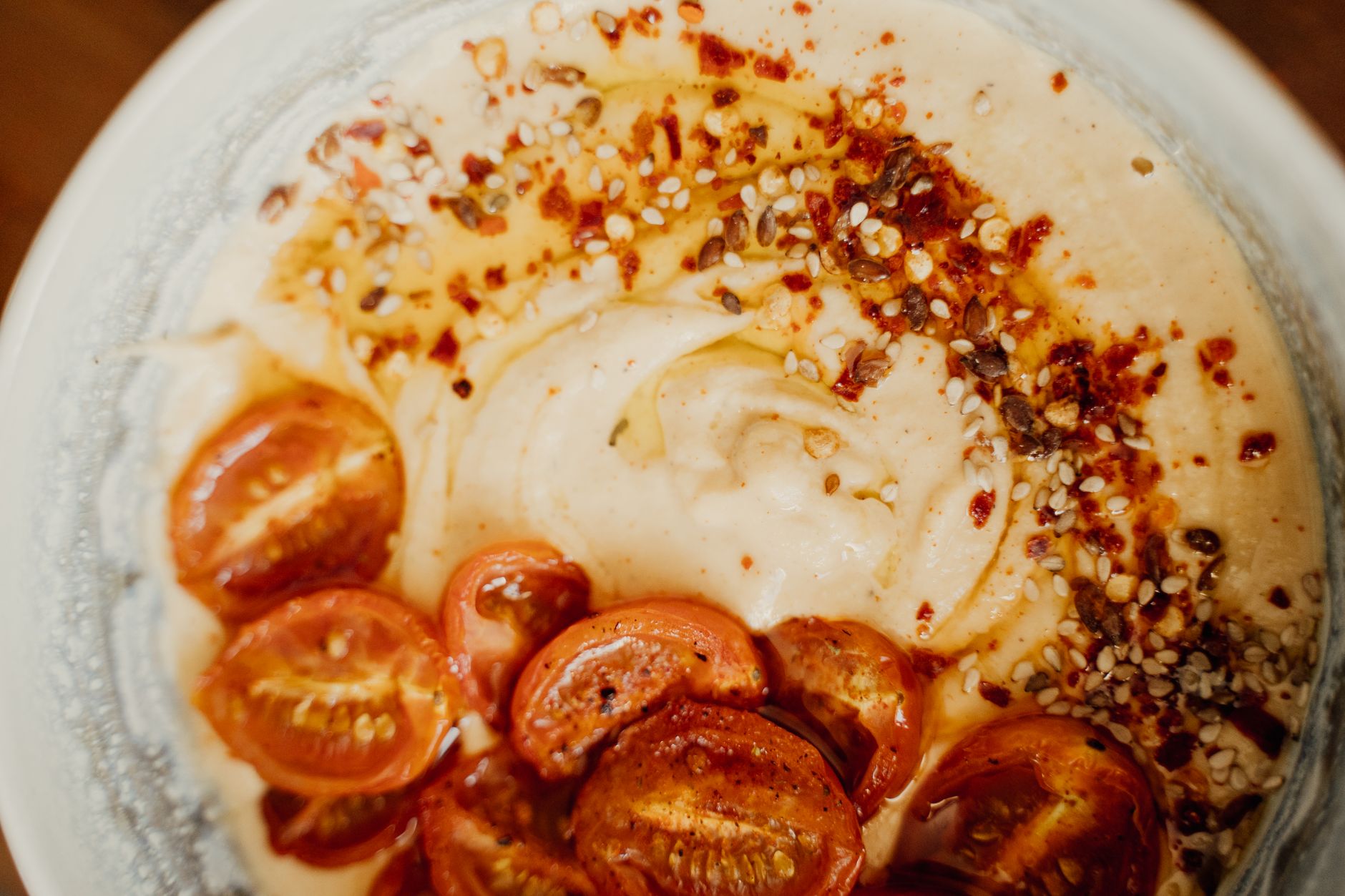 Delicious spiced hummus topped with roasted cherry tomatoes and sesame seeds. — Cat Food - 7 Tips On What To Avoid Feeding Yo