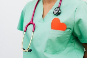 A healthcare professional with a stethoscope and red heart symbol emphasizes cardiology care. — Change Your Lifestyle With Yo