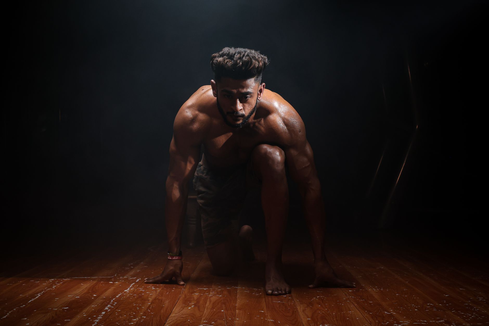 Dynamic image of a muscular man in a kneeling start position, highlighting strength and focus. — Do You Need Dialectical Beha