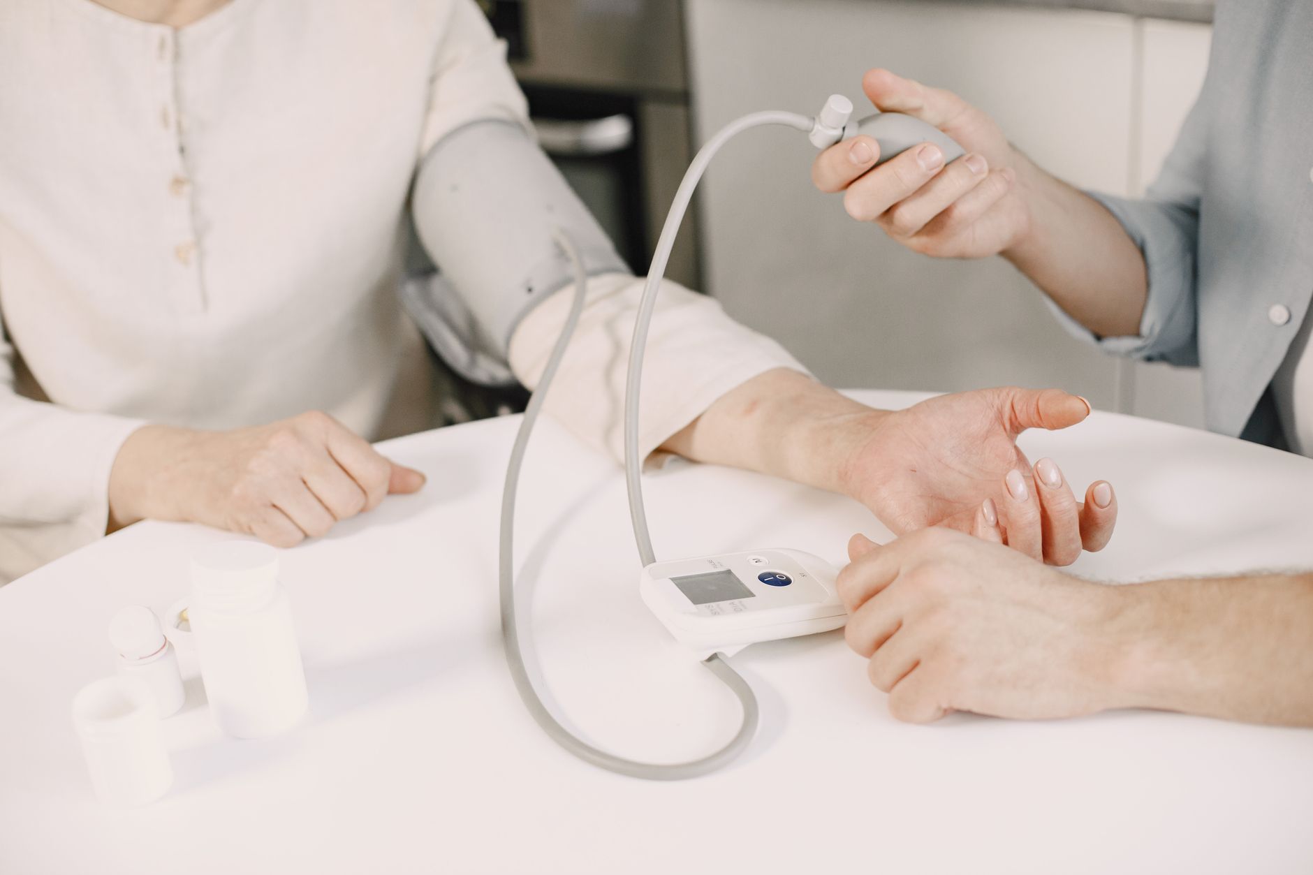 Close-up of blood pressure measurement at home highlighting healthcare equipment. — How to choose the best CBD Gummies for yo
