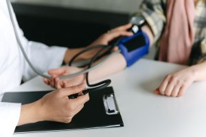 Close-up of a medical professional measuring a patient's blood pressure at a clinic. — It Takes Two to Tango- London erotic m