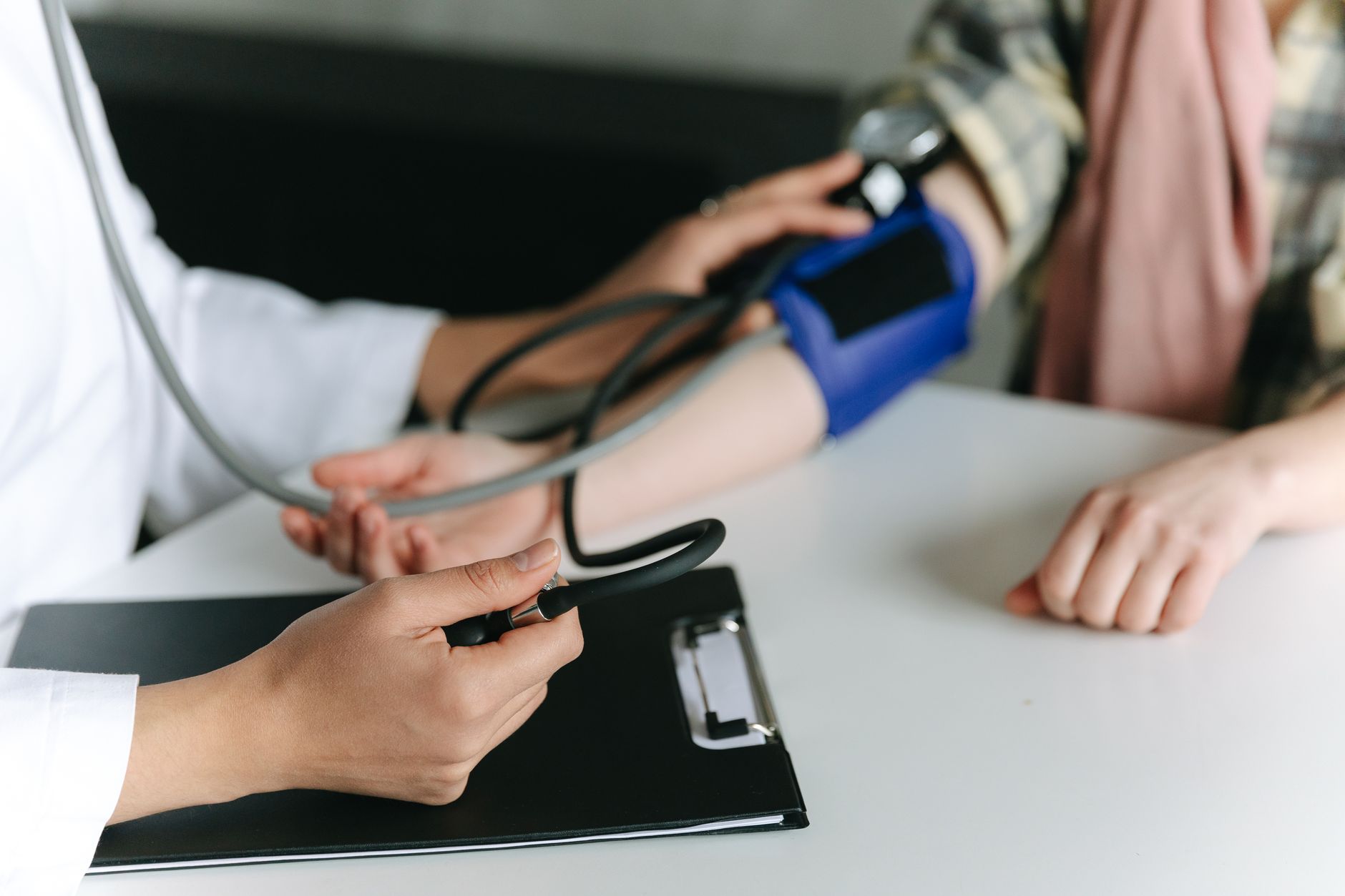 Close-up of a medical professional measuring a patient's blood pressure at a clinic. — It Takes Two to Tango- London erotic m