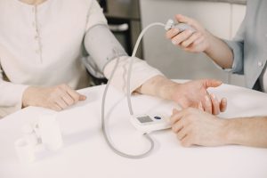 Close-up of blood pressure measurement at home highlighting healthcare equipment. — Spa Treatments during Pregnancy