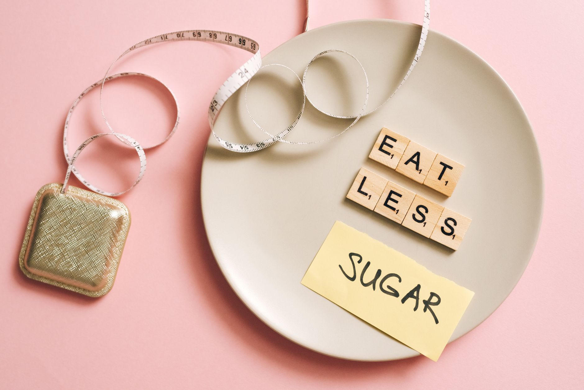 A conceptual image featuring a plate with messages made from Scrabble tiles and a tape measure, promoting healthy eating. — S