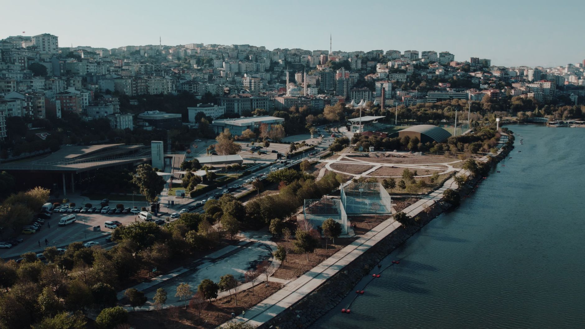 Aerial panoramic view of Istanbul's urban skyline and waterfront along the Golden Horn, showcasing architecture and natural b