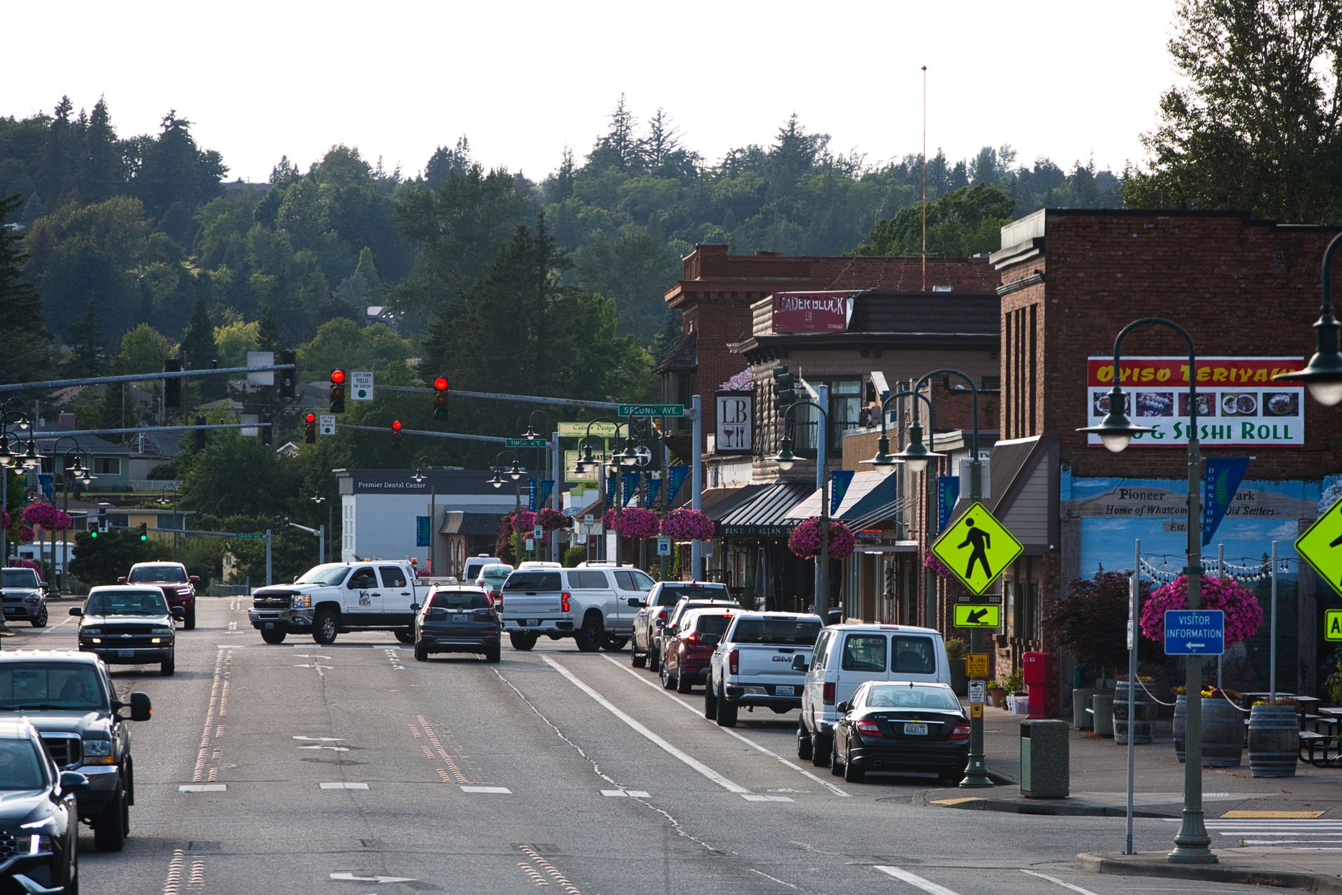 Lively urban street with cars, shops, and pedestrians during daytime. — The Impact of S250 Sustanon on Muscle Building and Pe