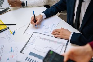 Professionals analyzing financial charts in a corporate setting. — The State of Hospital Security Today