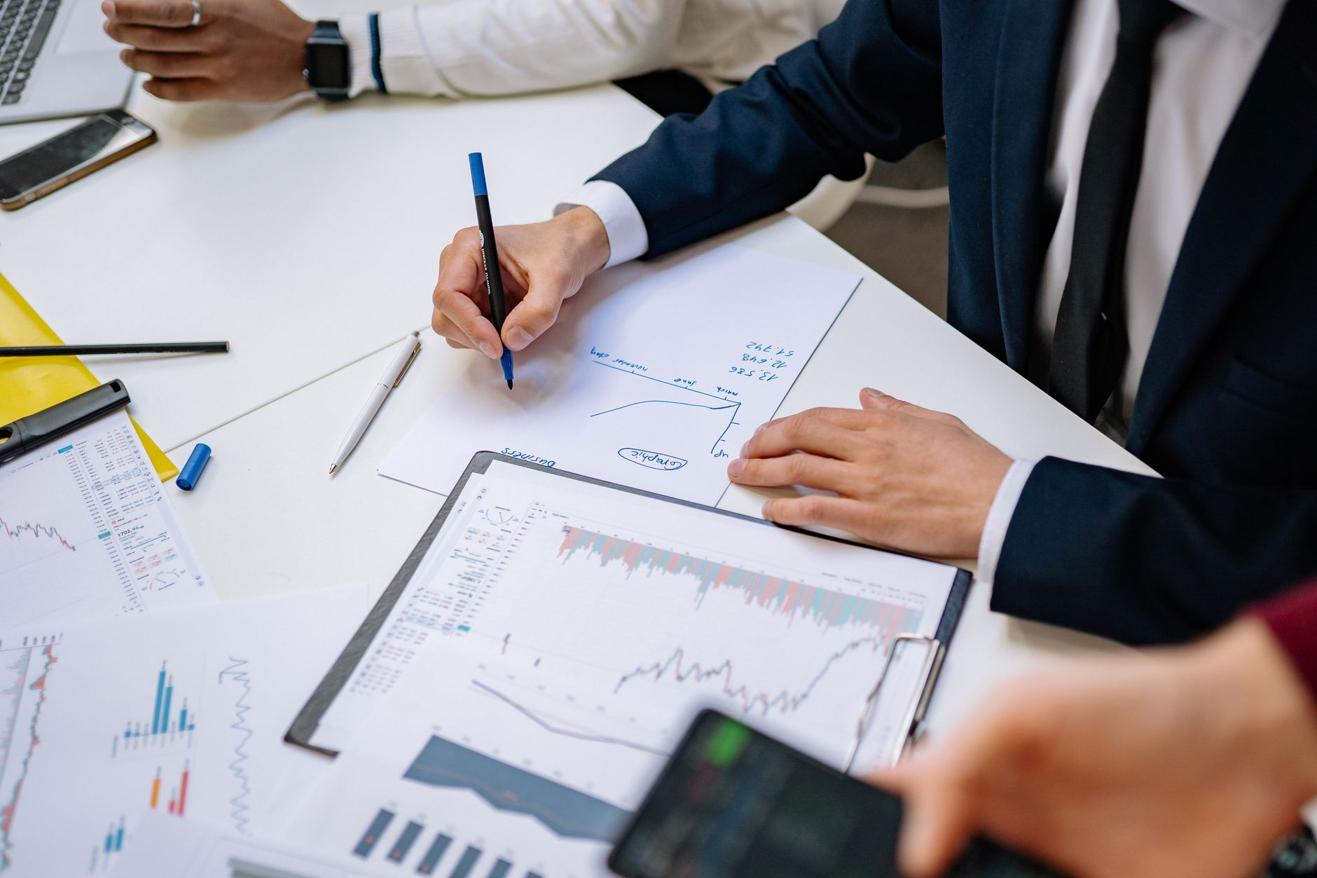 Professionals analyzing financial charts in a corporate setting. — The State of Hospital Security Today