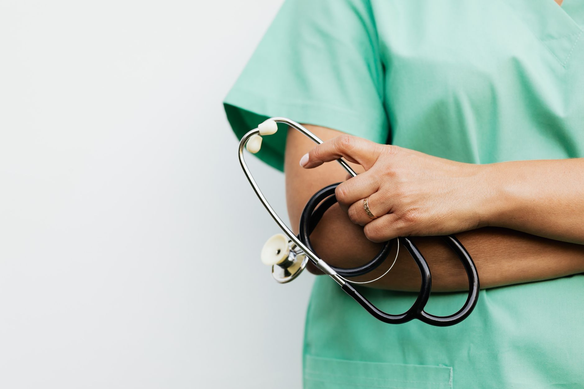 Close-up of a healthcare worker holding a stethoscope, showcasing medical professionalism. — What Do They Actually Mean By An