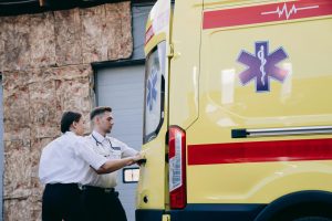 Two paramedics close the rear doors of an ambulance, preparing for emergency response. — What to Know When Getting an MRI