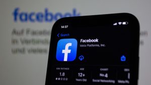 Close-up view of Facebook app on a modern smartphone, emphasizing technology. — Why Successful Brands Buy Instagram Reels Lik