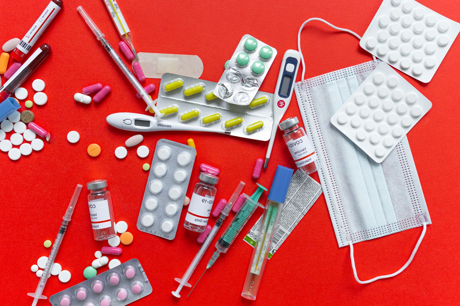 Medical supplies and medications displayed on a red background, emphasizing healthcare essentials. — YOUR GUIDE TO TEETH WHIT
